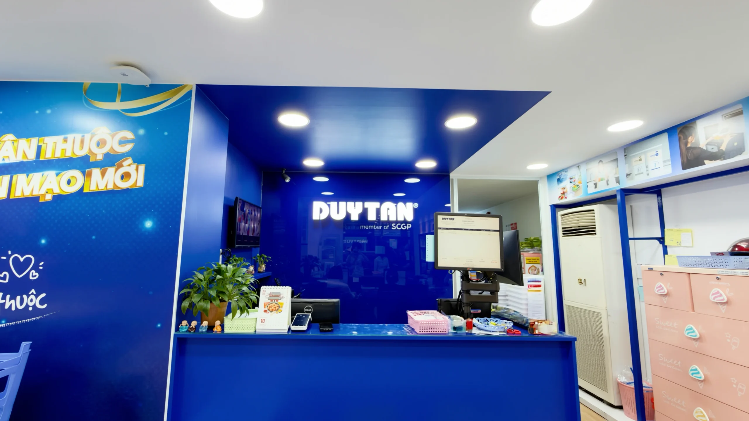 Duy Tan showroom facade with signature blue brand identity and large logo signage